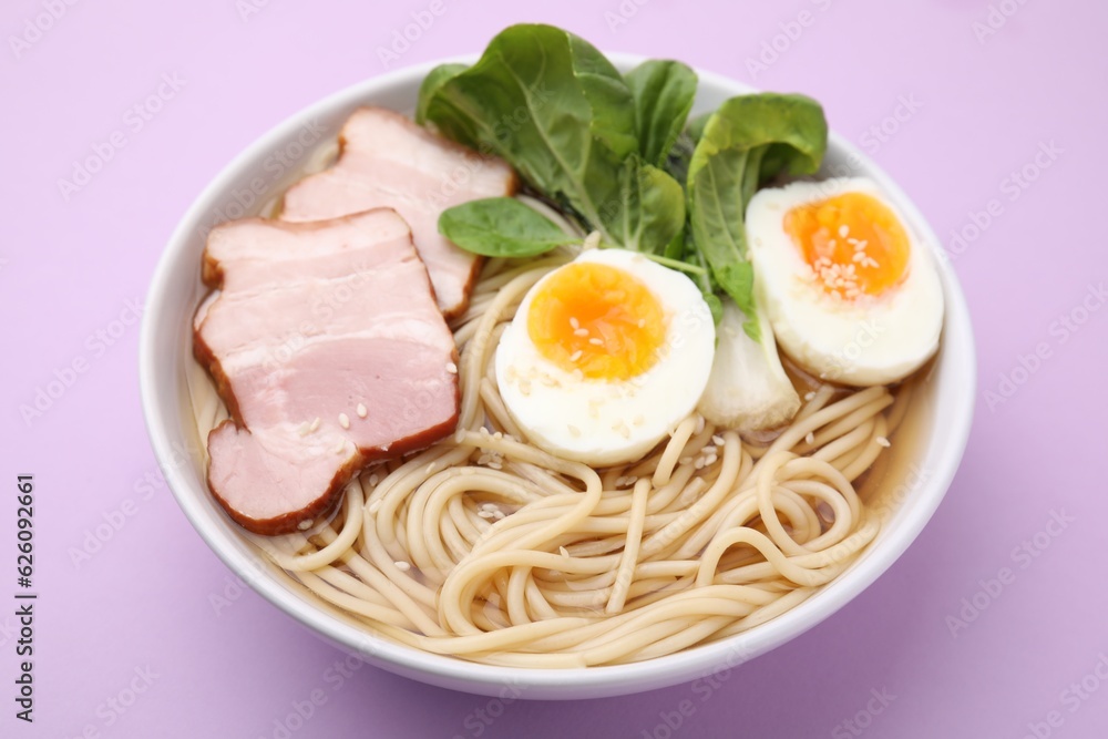 Delicious ramen with meat on violet background, closeup. Noodle soup Delicious ramen with meat on violet background, closeup. Noodle soup