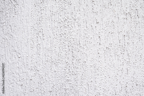 Wall with irregular plaster texture, use for backgrounds, gray color