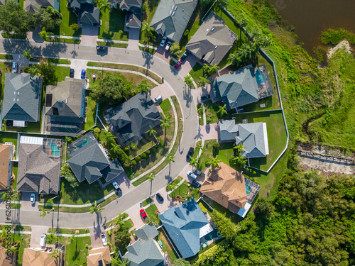 Drone photo of suburban area near New Port Richey Florida with houses and buildings in summer weather