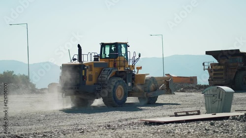 Production equipment escavators, dumper trucks for the extraction of iron ore in a quarry. The process of mining iron ore in a quarry.