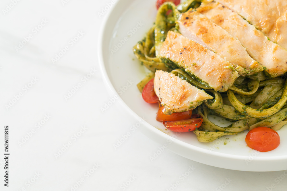 fettuccine spaghetti pasta in pesto sauce with grilled chicken fettuccine spaghetti pasta in pesto sauce with grilled chicken