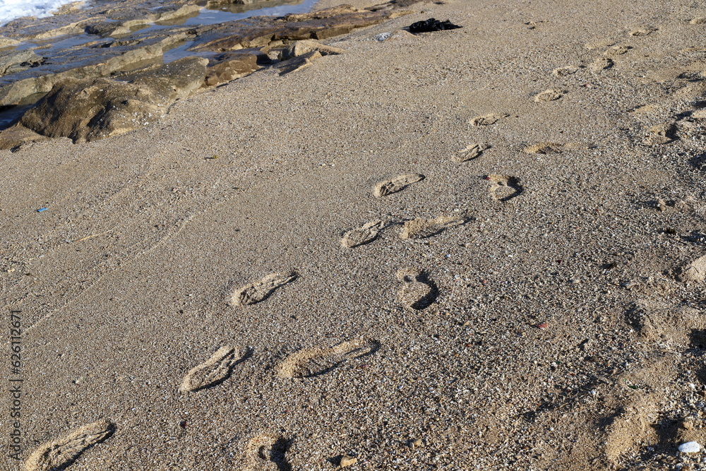 Footprints in the sand on the mediterranean sea Footprints in the sand on the mediterranean sea