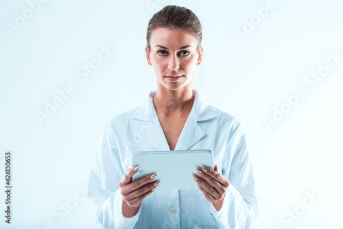 Scientific woman, scrutinizing data, white tablet