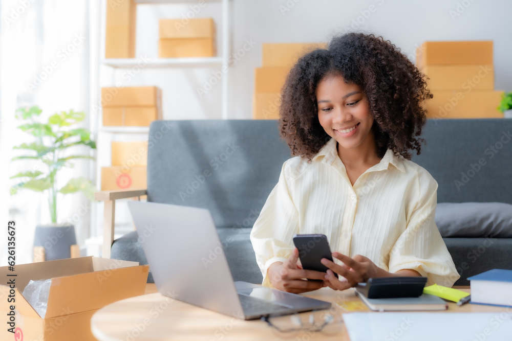 Online business owner is using mobile phone checking with customer to check delivery address and phone number for accurate delivery. Online business owner is using mobile phone checking with customer to check delivery address and phone number for accurate delivery.