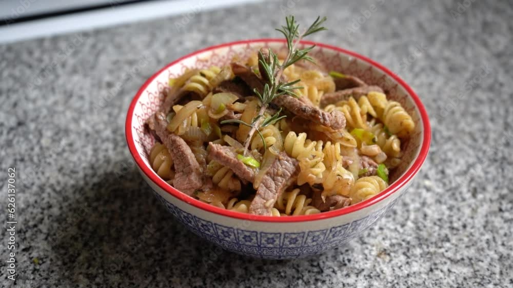 Bowl of pasta with meat. Delicious meal made at home. Bowl of pasta with meat. Delicious meal made at home.
