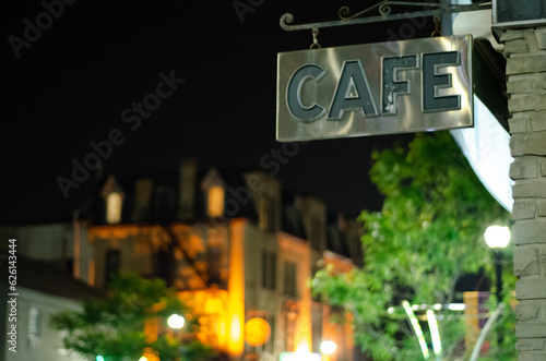Steel cafe sign in historic city setting
