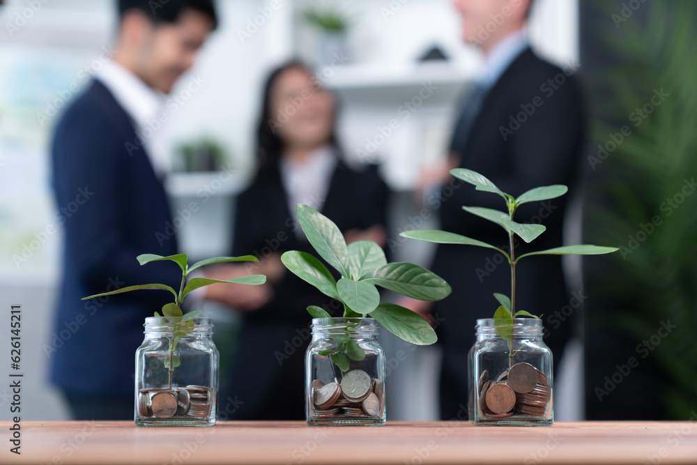 Organic money growth investment concept shown by money savings in glass