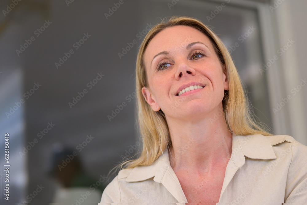 Portrait of a 40 year old attractive woman sitting on the terrace Portrait of a 40 year old attractive woman sitting on the terrace