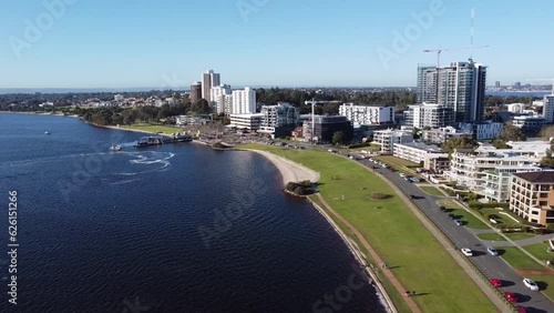 Drone Aerial View of South Perth foreshore to circling over Mendes St Jetty along Swan River and cycle path