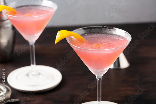 Classic Cosmopolitan Cocktail alcoholic gin, triple sec liqueur, fresh lemon juice and raspberry sugar syrup photo