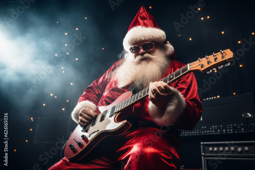 Fototapete A person dressed as Santa Claus plays electric guitar