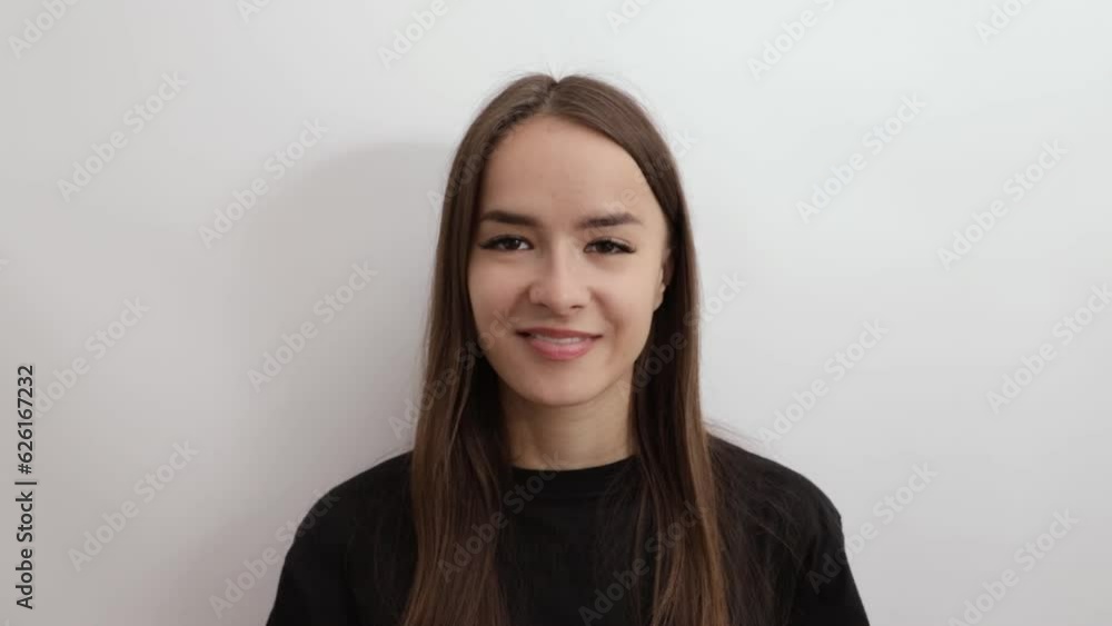Teenager schoolgirl smiling on white background, back to school, young woman student with long hair Teenager schoolgirl smiling on white background, back to school, young woman student with long hair