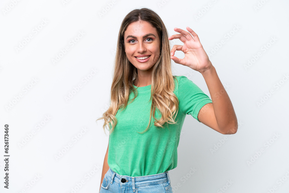 Young Uruguayan woman isolated on white background showing ok sign with fingers Young Uruguayan woman isolated on white background showing ok sign with fingers