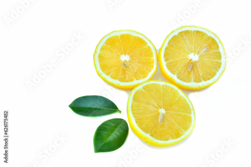 Lemon.with fresh green leaves.sliced.laying isolated.in on a white background