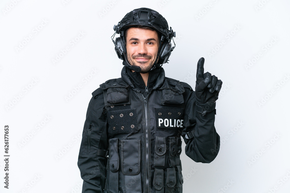 Young caucasian SWAT man isolated on white background showing and lifting a finger in sign of the best Young caucasian SWAT man isolated on white background showing and lifting a finger in sign of the best