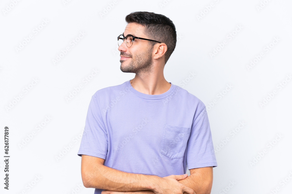 Young caucasian man isolated on white background looking to the side and smiling Young caucasian man isolated on white background looking to the side and smiling
