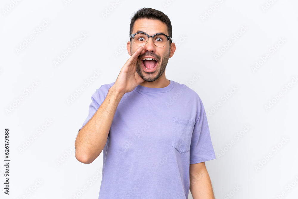 Young caucasian man isolated on white background with surprise and shocked facial expression Young caucasian man isolated on white background with surprise and shocked facial expression