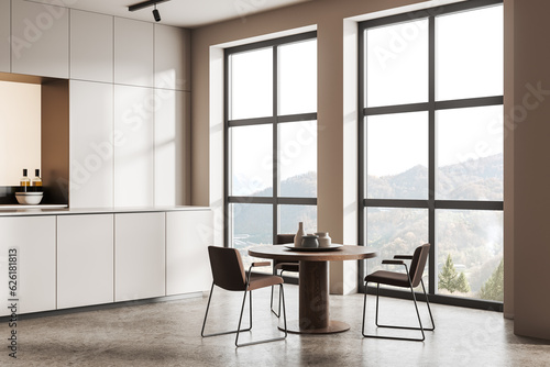 White kitchen corner with cabinets and dining table