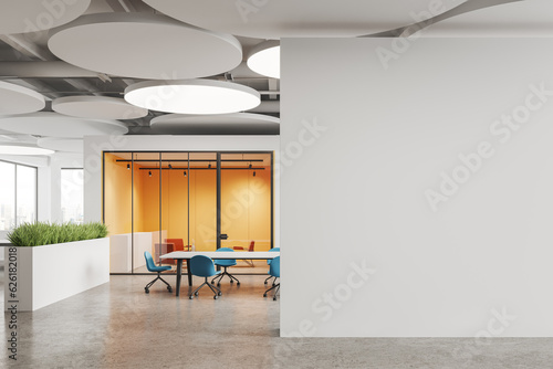 White and yellow office meeting room with blank wall