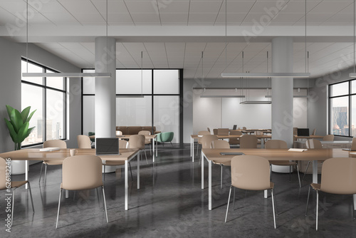 Modern office interior with desk and chairs, business coworking and chill zone