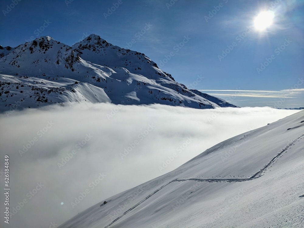 Wonderful ski tour in the fresh deep snow above davos and engadine. Ski mountaineering in the Swiss mountains. High quality photo