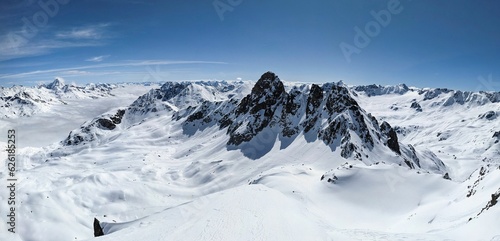 Back country ski tour on the Radüner Rothorn with a view of the Piz Radönt. Ski mountaineering skimo. Davos Klosters Switzerland. High quality photo