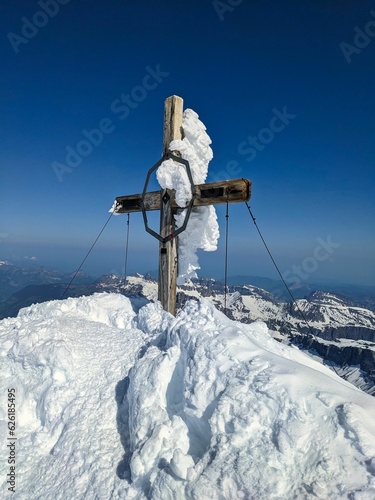 Summit cross on Mount Clariden. Ski mountaineering in winter and spring. High quality photo