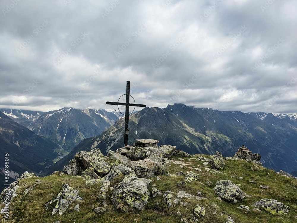 Summit cross on the Hauerkogel mountain in Austria above Langenfeld near Solden. Super nice view. High quality photo.
