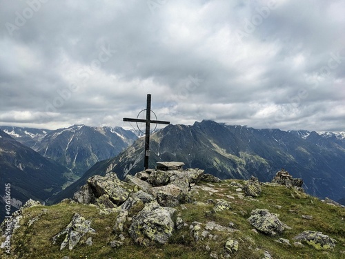 Summit cross on the Hauerkogel mountain in Austria above Langenfeld near Solden. Super nice view. High quality photo. photo