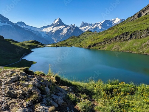 Mountain lake in the bernese oberland. Bachsee near Grindelwald and Interlaken. Beautiful sunrise mood. Bachsee. High quality photo © SimonMichael
