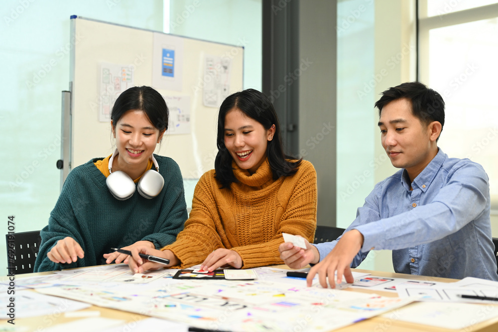 Group of application developers working on new website wireframe, planning application development at office Group of application developers working on new website wireframe, planning application development at office