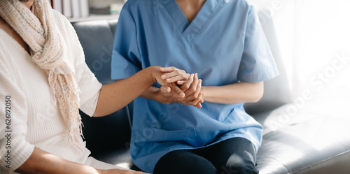 Kind nurse together with elderly woman in the hospital s