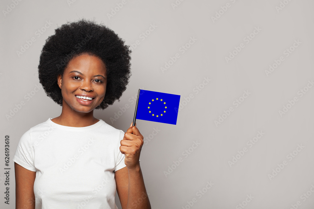 European woman holding flag of EU, European Union. Education, business, citizenship and patriotism concept European woman holding flag of EU, European Union. Education, business, citizenship and patriotism concept