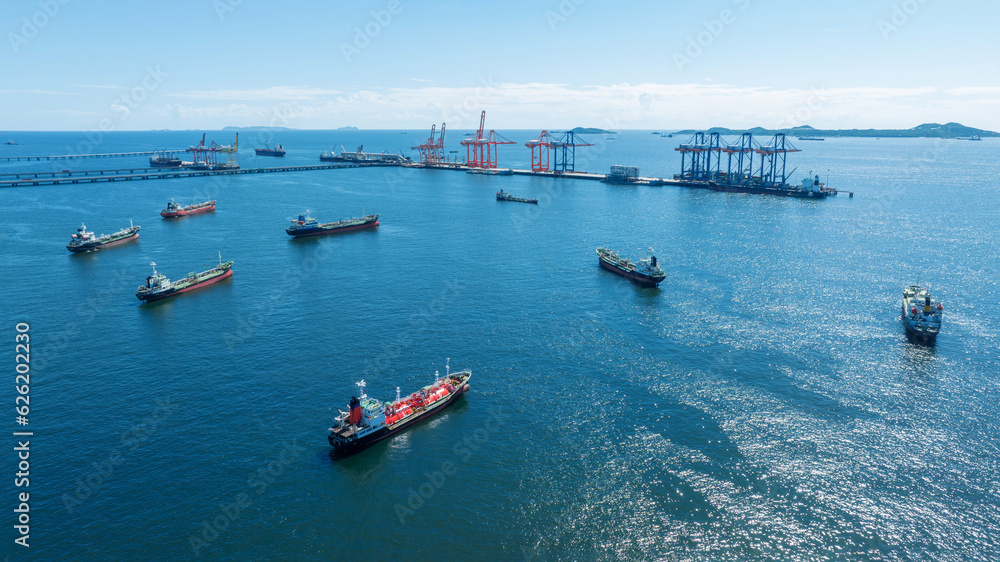 Cargo container Ship running on Bridge Cargo Shipyard. Container ship under the crane Sea Port service logistics and transportation. International Shipping Depot Customs Port for import export trading