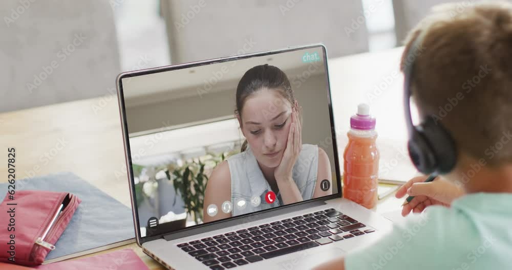 Composition of caucasian boy on laptop online learning with caucasian female teacher Composition of caucasian boy on laptop online learning with caucasian female teacher