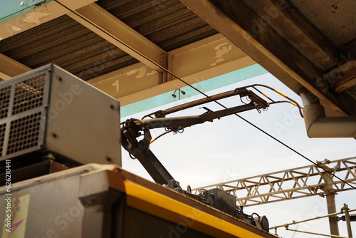 A pantograph is an apparatus mounted on the roof of an electric train, tram or electric bus to collect power through contact with an overhead line.
