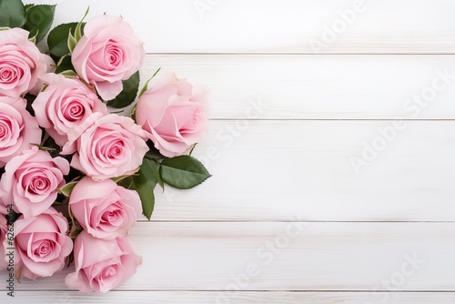 Bouquet of beautiful pink roses on white wooden background with copy space. Women's Day, Mother's Day, Valentine's Day, Wedding concept. © id512