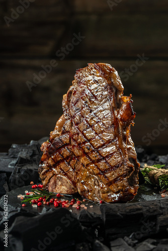 porterhouse steak or T Bone Steak. vertical image. place for text