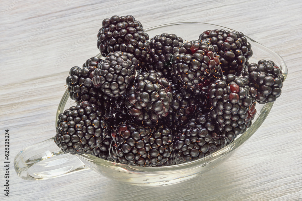 Berries. Fresh ripe blackberries in glass bowl on rustic table Berries. Fresh ripe blackberries in glass bowl on rustic table