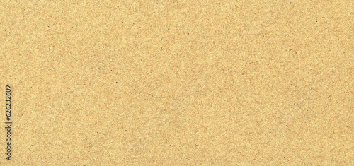 Beige grainy paper or wall background.