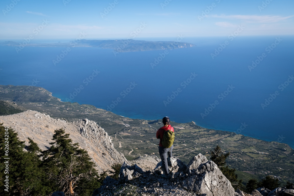 Epic scenery with hiker on top of Mount Ainos, the tallest mountain on the Ionian island of Cephalonia