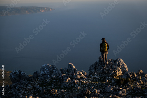 Epic scenery with hiker on top of Mount Ainos, the tallest mountain on the Ionian island of Cephalonia photo
