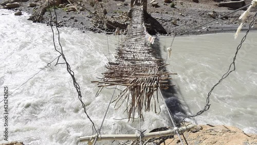 Traditional bridge across the Tsarab Chu River, Phugtal, (Phuktal) Zanskar, Ladakh, India photo