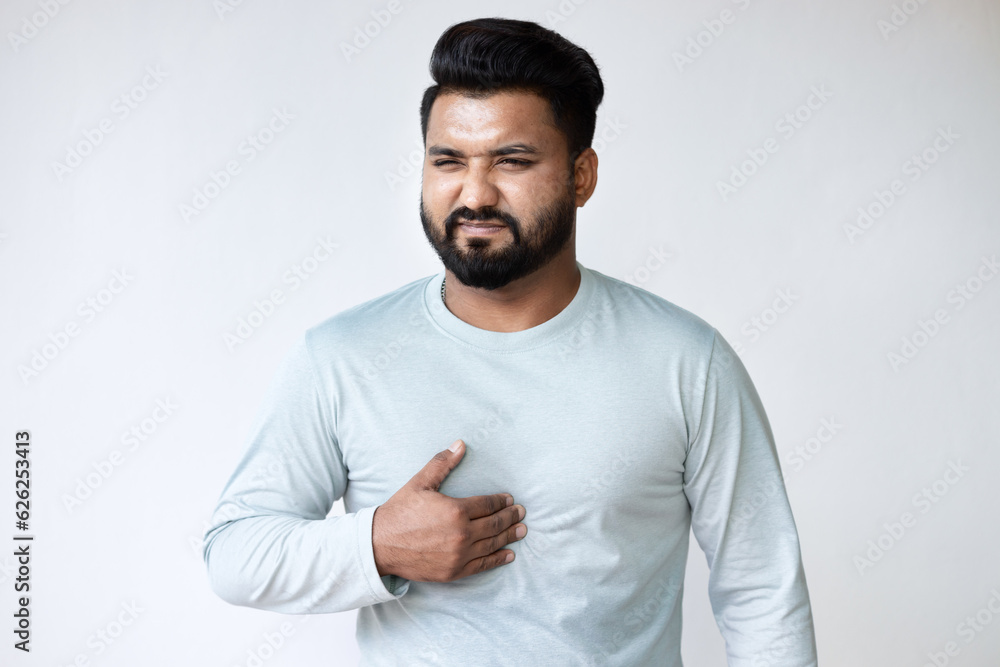 Acid Reflux and Heartburn, Sick South Asian Man Experiencing GERD Symptoms Acid Reflux and Heartburn, Sick South Asian Man Experiencing GERD Symptoms