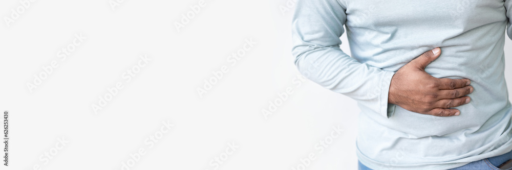 Ill South asian Indian man with stomachache concept image for hungry man, hunger, abdominal pain, diarrhea, constipation, food poisoning, gastritis, acid reflux, ulcer, stomach cancer, colon cancer Ill South asian Indian man with stomachache concept image for hungry man, hunger, abdominal pain, diarrhea, constipation, food poisoning, gastritis, acid reflux, ulcer, stomach cancer, colon cancer