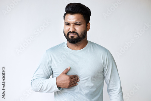 Acid Reflux and Heartburn, Sick South Asian Man Experiencing GERD Symptoms photo