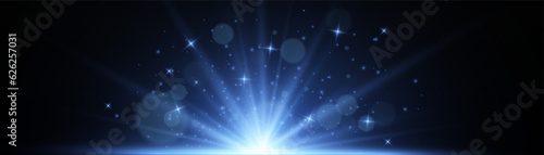 Blue rays rising up on a dark background. Vector illustration of an explosion with flying gold dust.