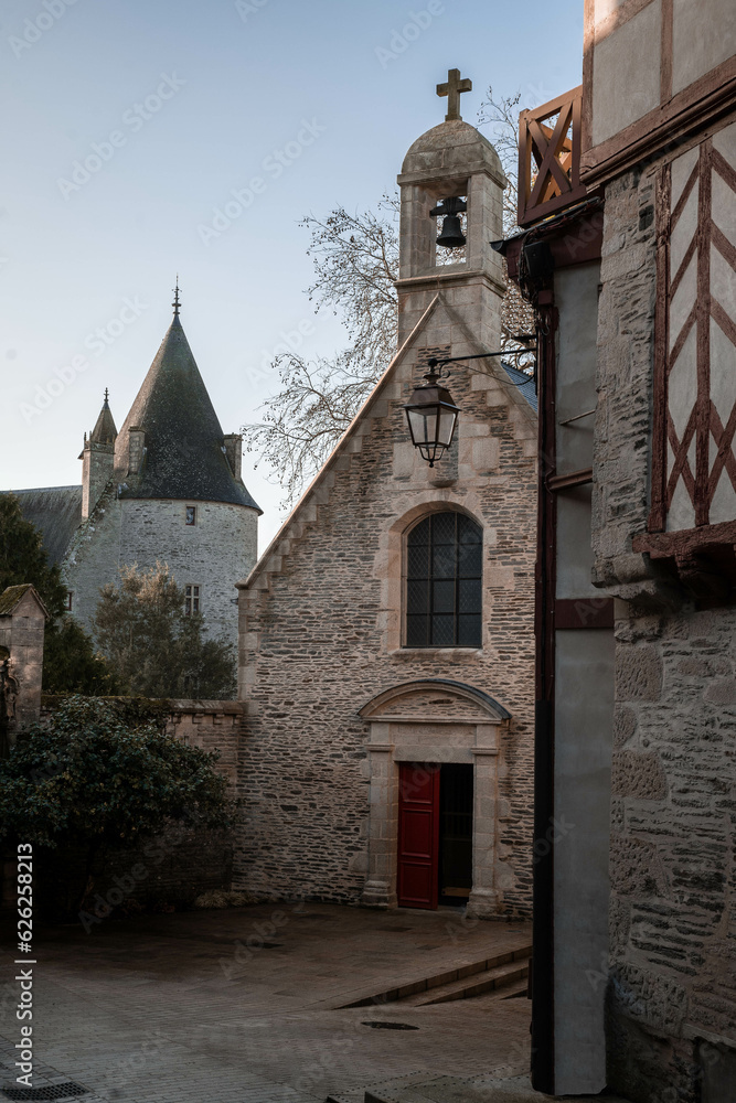 Naklejka premium Old castle and church in Josselin, Brittany, France