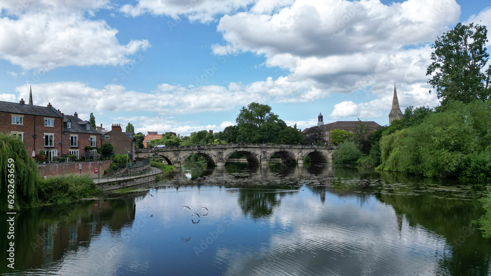 Beautiful historical bridge in a countryside with river reflection.