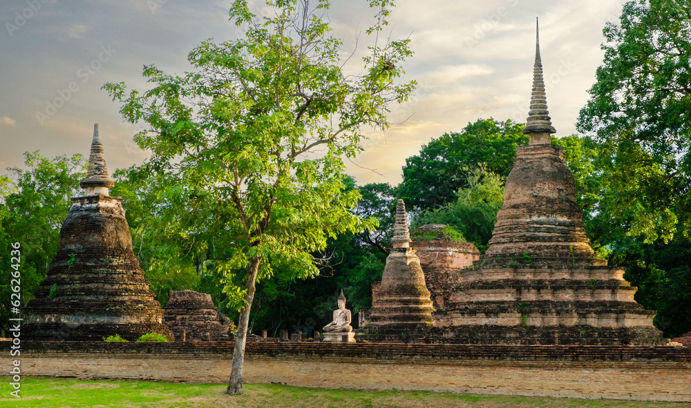 Wat Mahathat Buddhist temple in Sukhothai historical park Thailand. UNESCO, World Heritage Site. Travel concept.